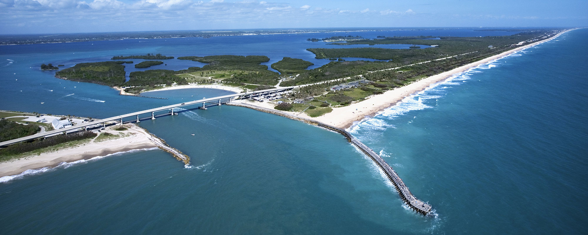 Aerial view of Indian River Lagoon Scenic Highway on Melbourne Beach Florida with inlet and pier